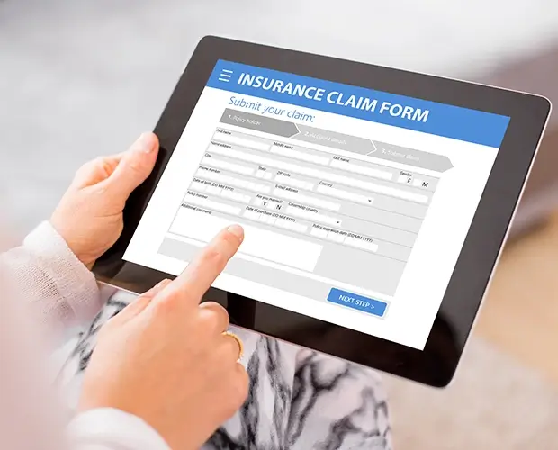 Insurance claim form on a laptop